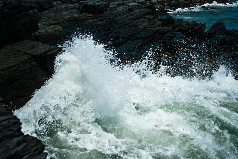 Waves crashing on rocky shore