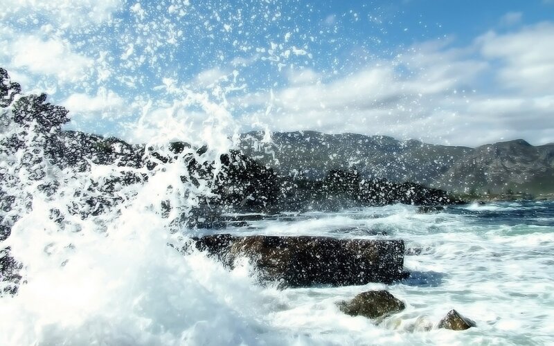 Waves crashing on rocky shore