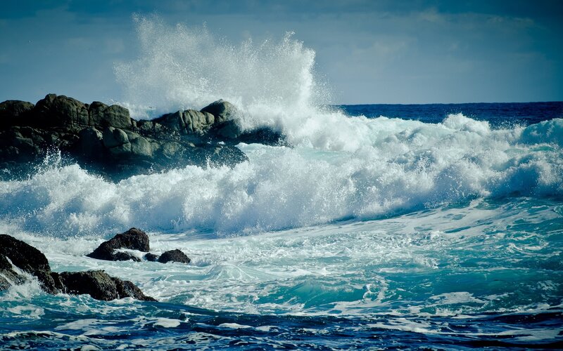 Waves crashing on rocky shore
