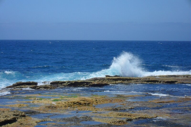 Waves crashing on rocky shore