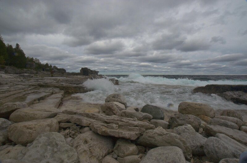 Waves crashing on rocky shore
