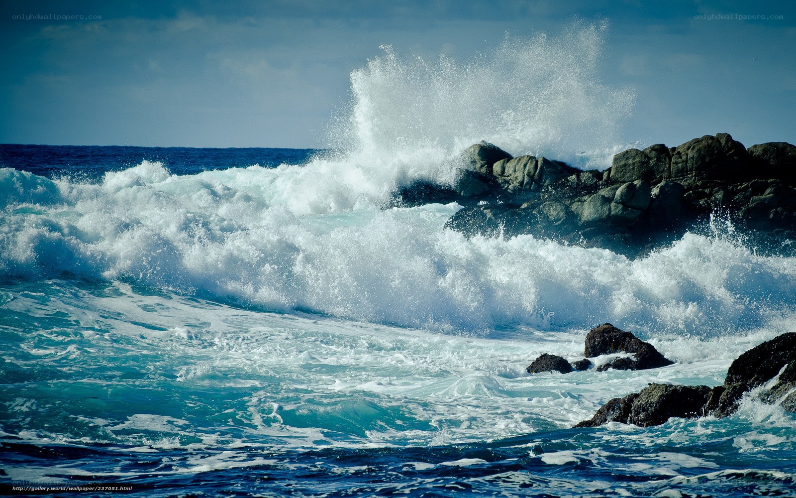 Waves crashing on rocky shore