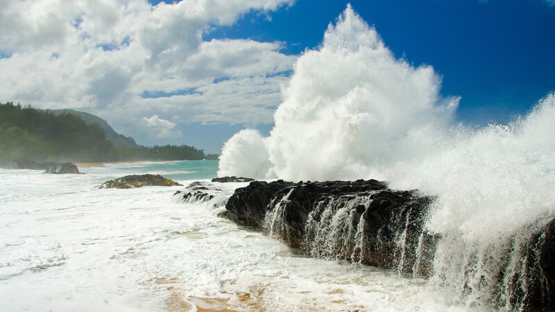 Waves crashing on rocky shore