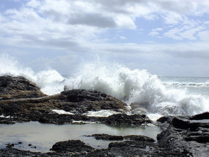 Waves crashing on rocky shore