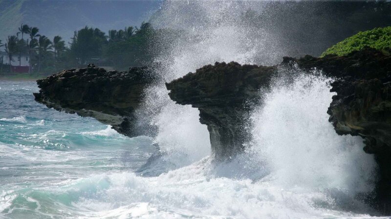 Waves crashing on rocky shore