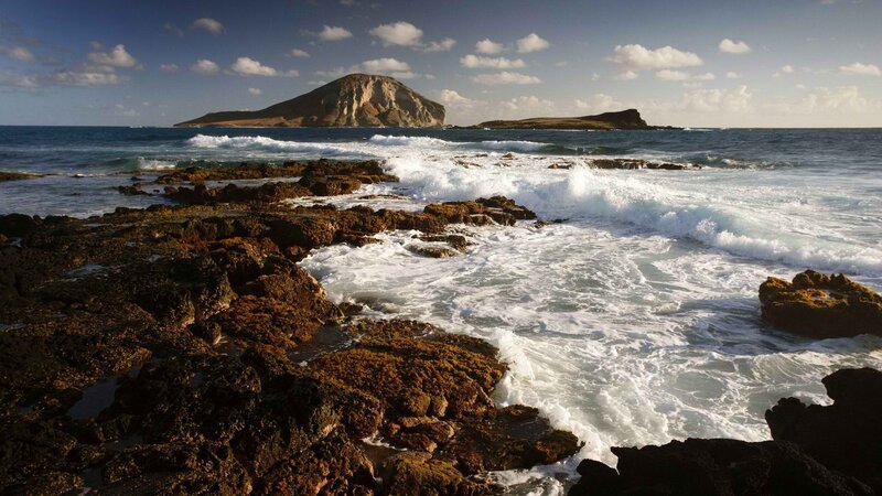 Waves crashing on rocky shore