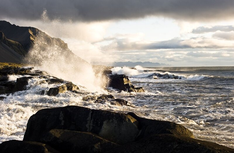 Waves crashing on rocky shore