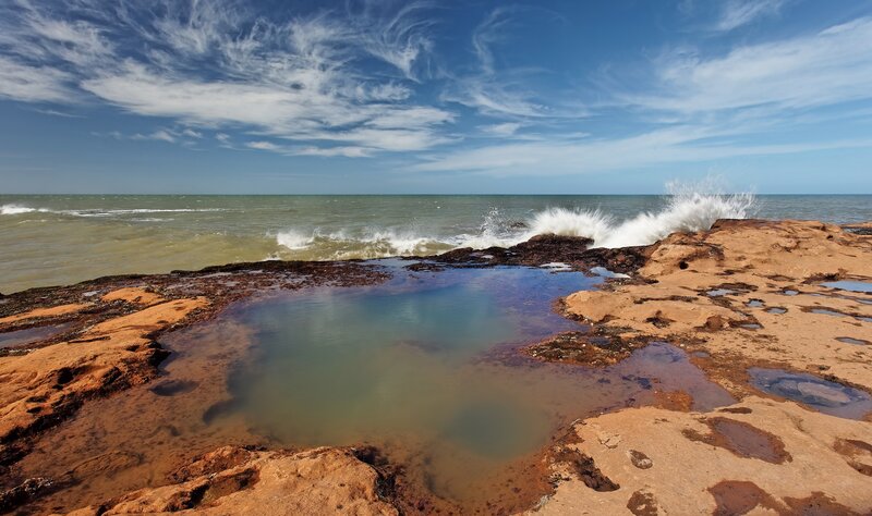 Waves crashing on rocky shore