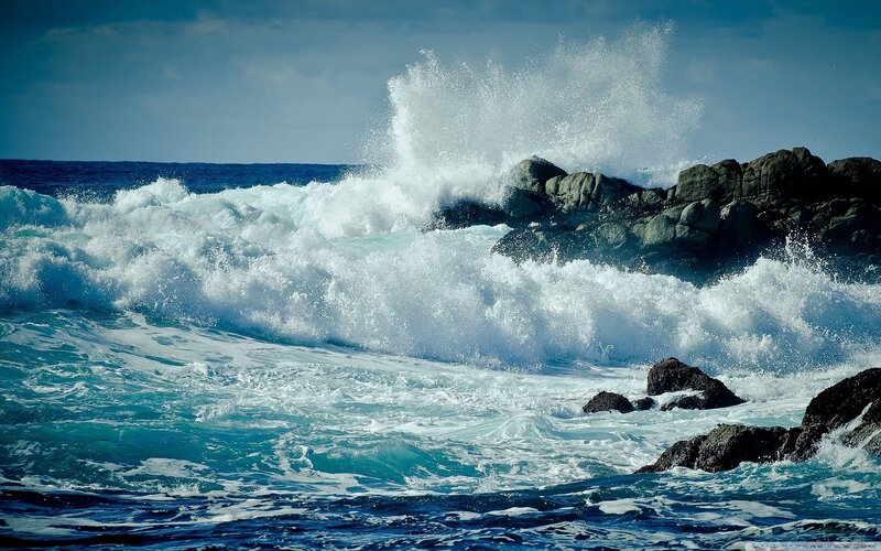 Waves crashing on rocky shore