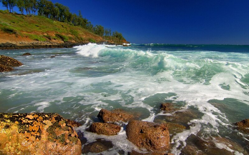 Waves crashing on rocky shore