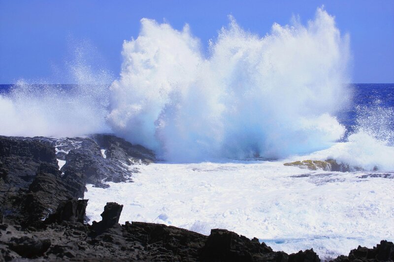 Waves crashing on rocky shore