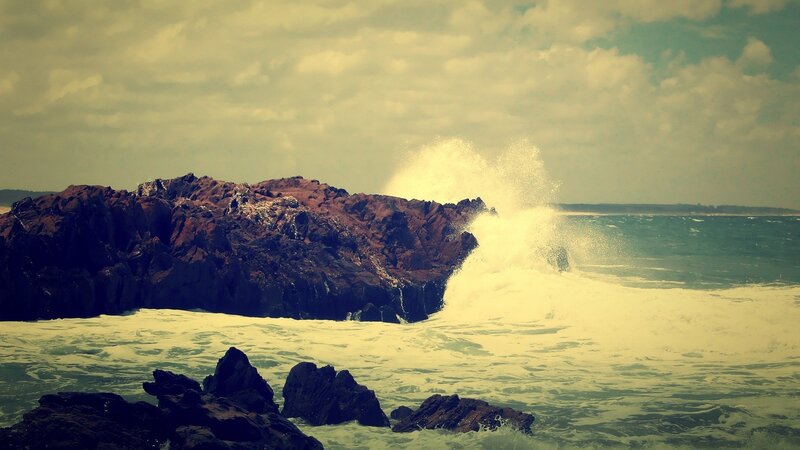 Waves crashing on rocky shore