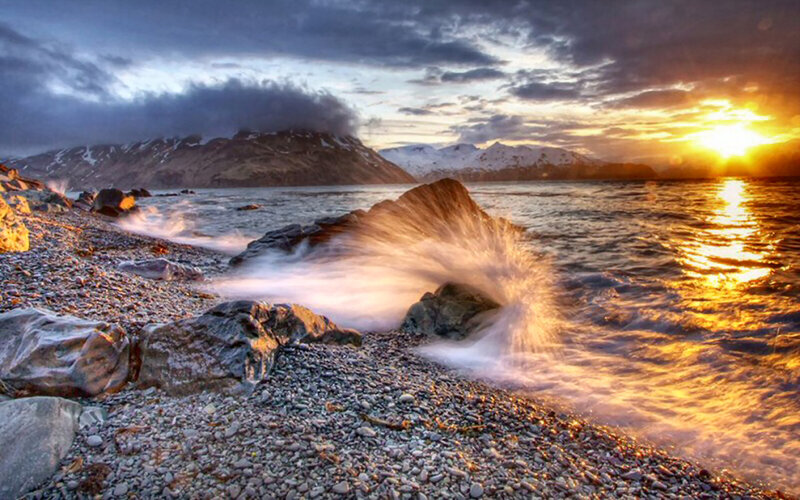Waves Crashing on Rocky Shore — Blue, Dramatic, Sunset