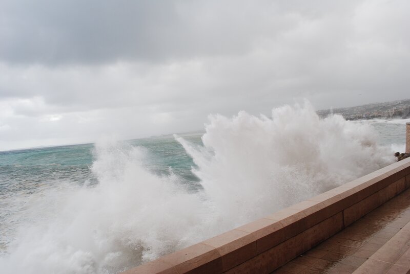 Waves crashing on sea wall