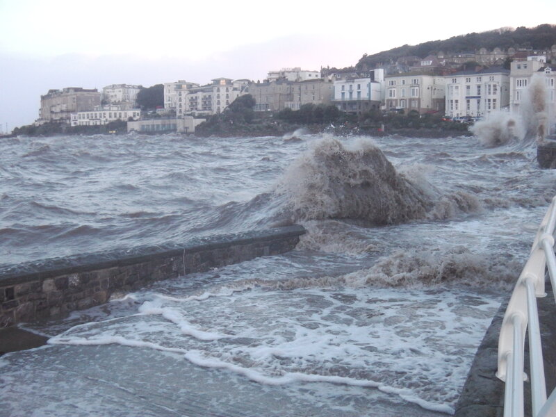 Waves Crashing on Sea Wall — Gray