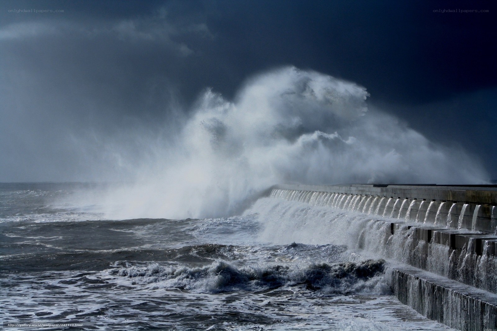 Waves crashing on sea wall