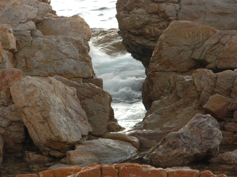 Waves Crashing Through Rocks