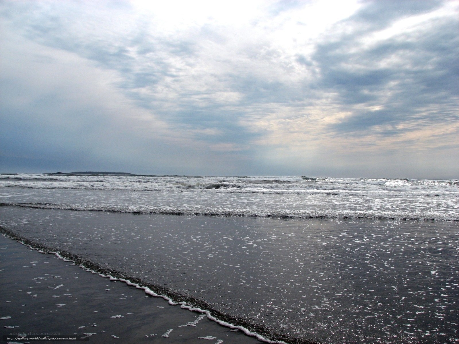 Waves on a cloudy beach