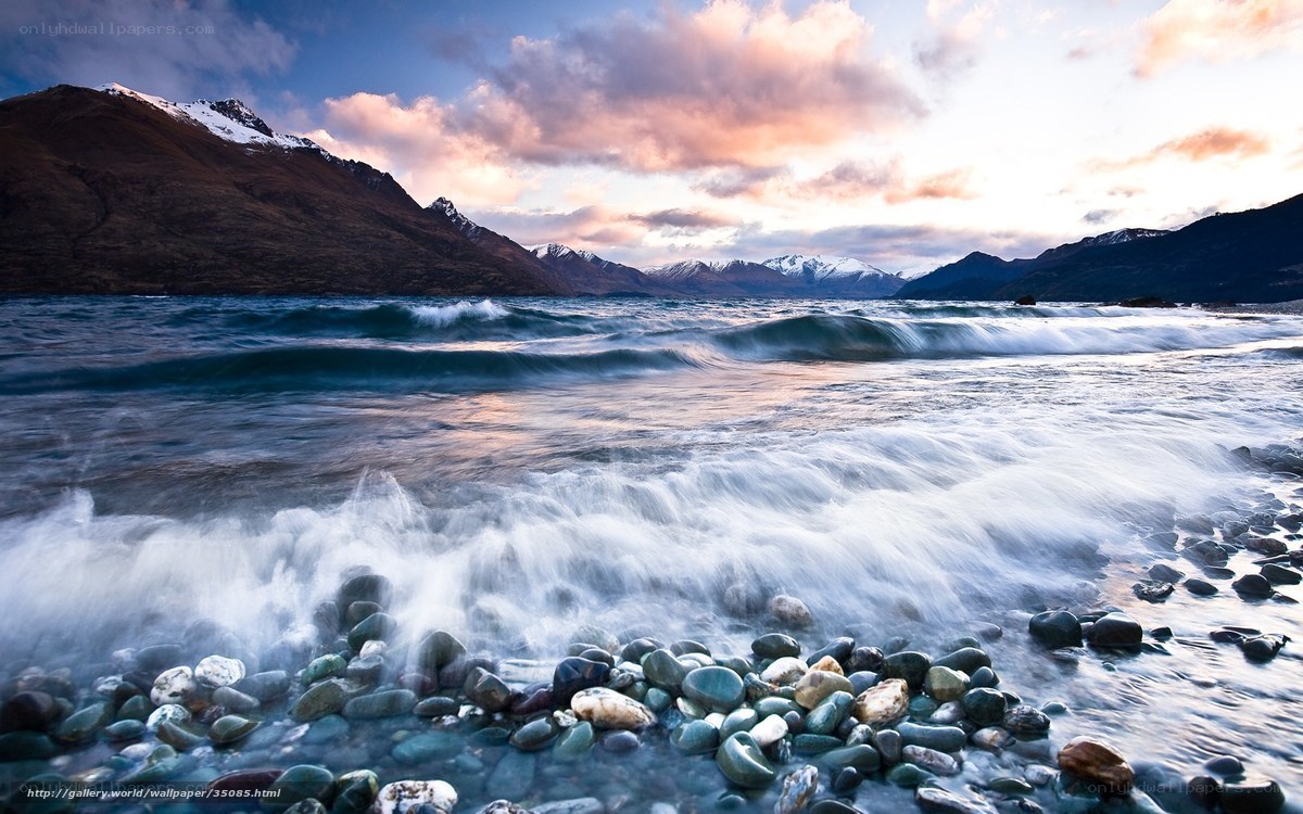 Waves on a rocky shore at sunset