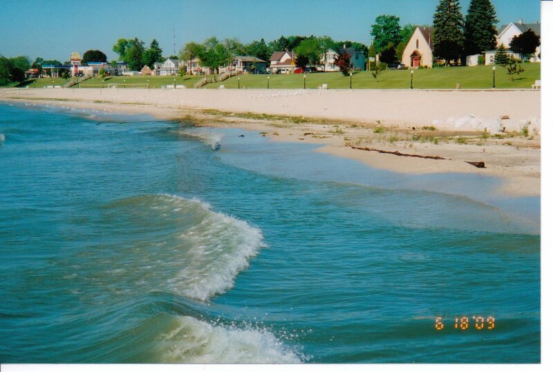Waves on Sandy Beach — Blue, Serene, Afternoon, Photograph, Houses