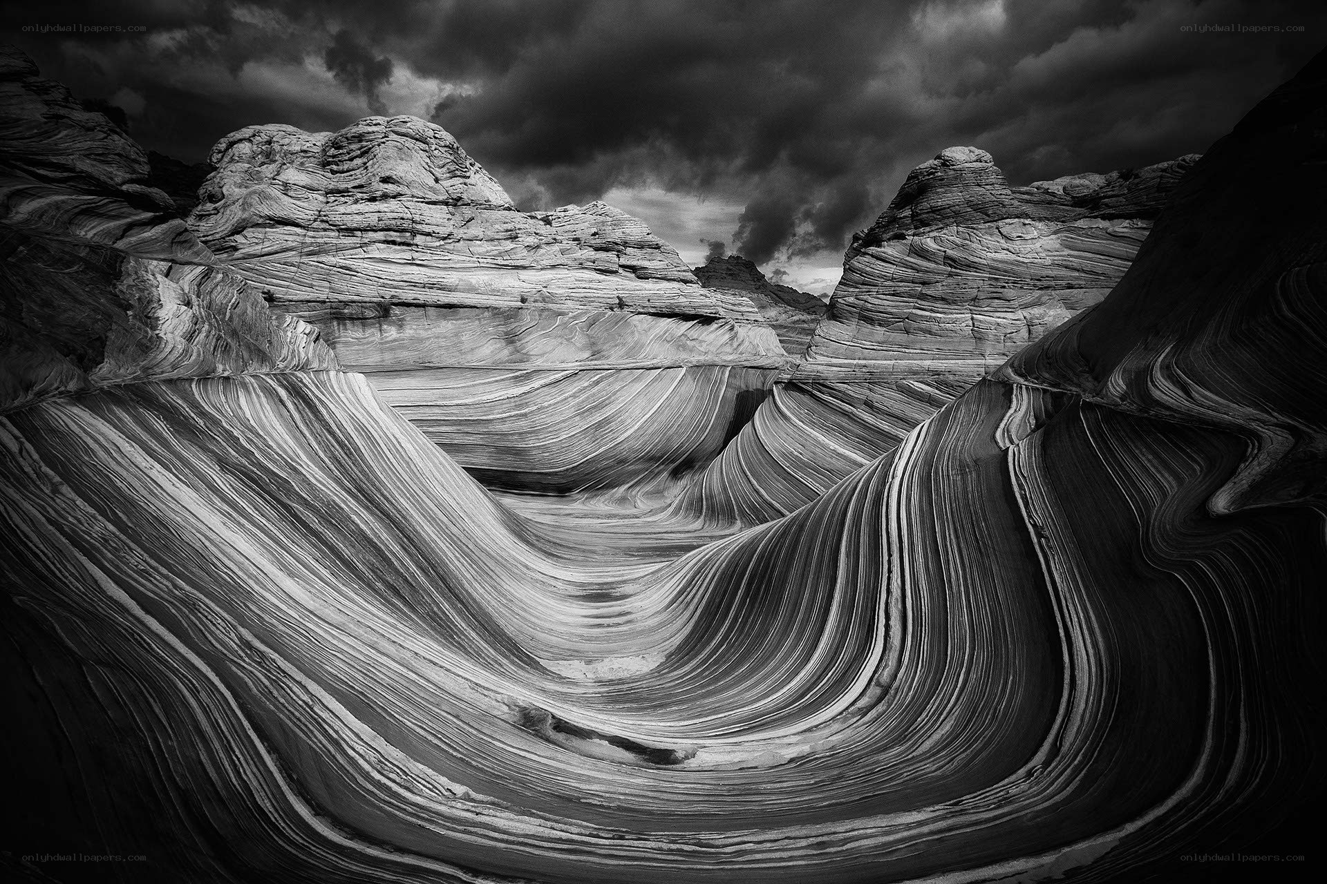 Wavy rock formations under stormy sky