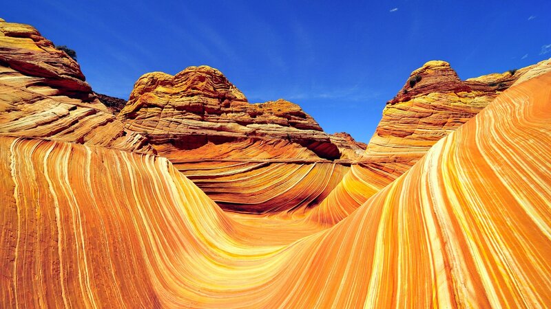 Wavy Sandstone Formations — Orange, Dramatic, Afternoon