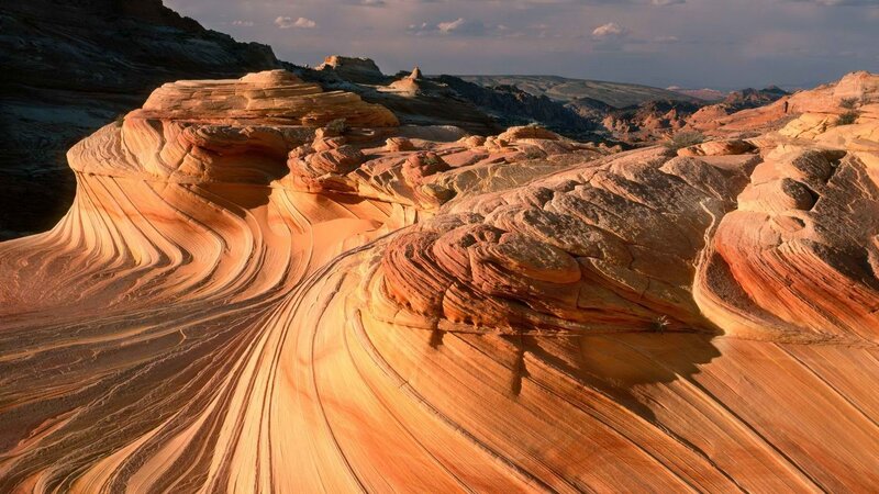 Wavy Sandstone Formations — Orange, Dramatic, Sunset