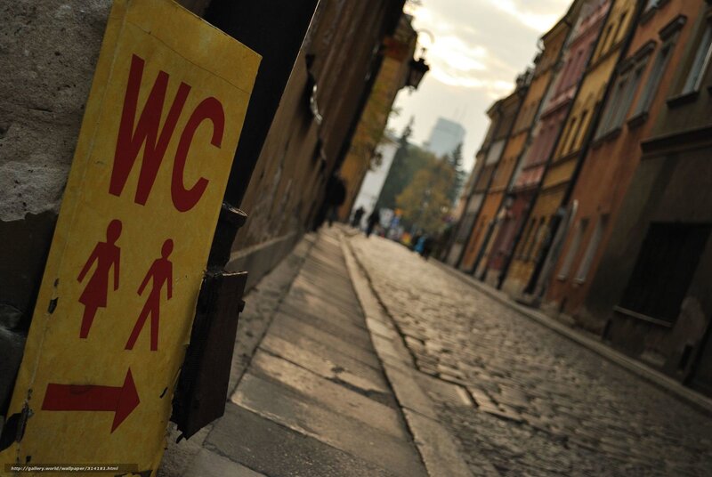 WC sign on cobblestone street