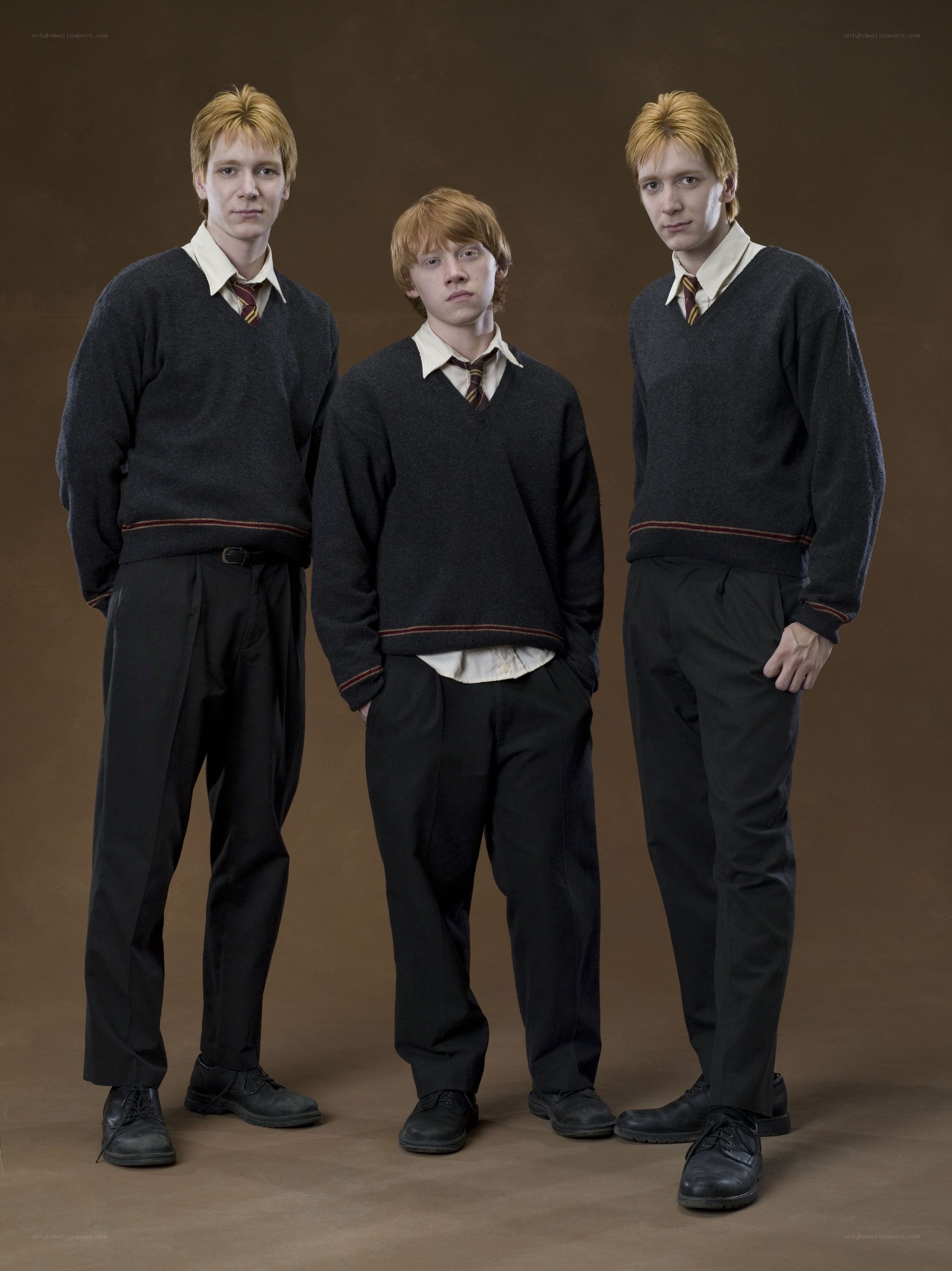Weasley brothers in school uniforms