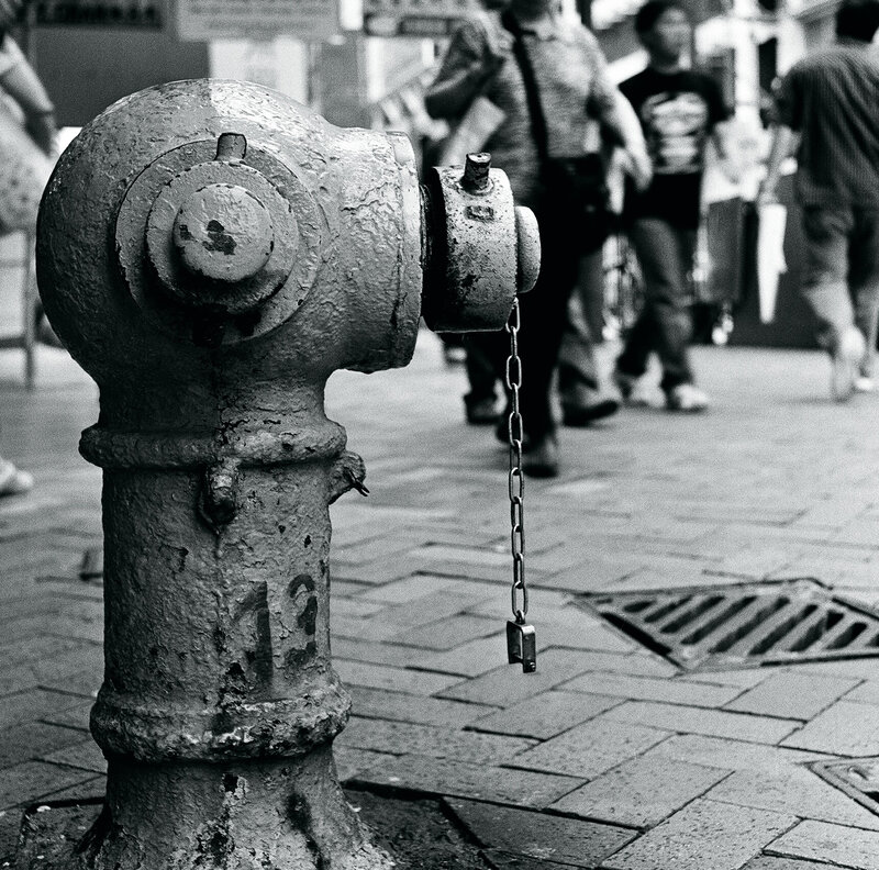 weathered fire hydrant on sidewalk