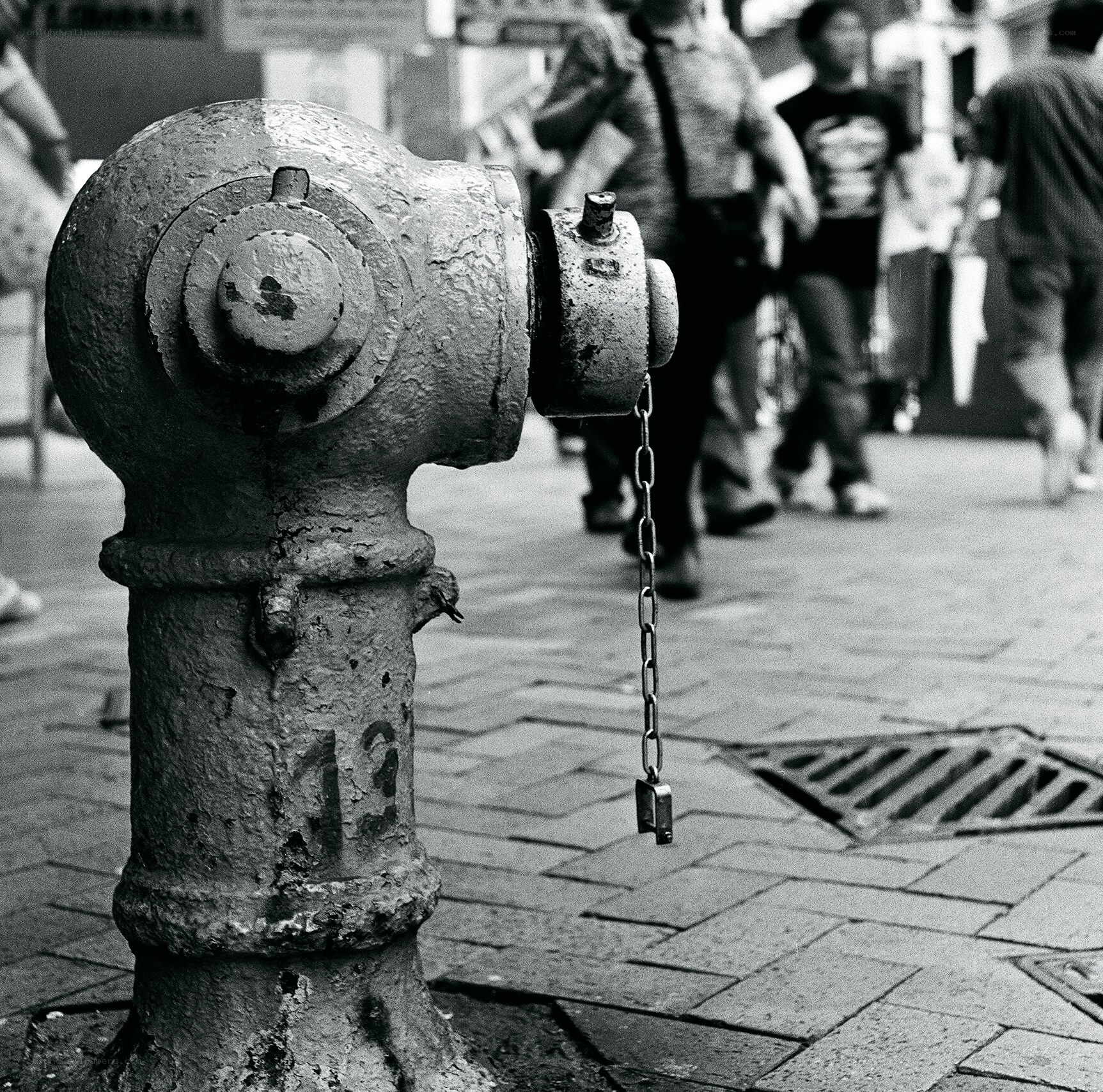 weathered fire hydrant on sidewalk