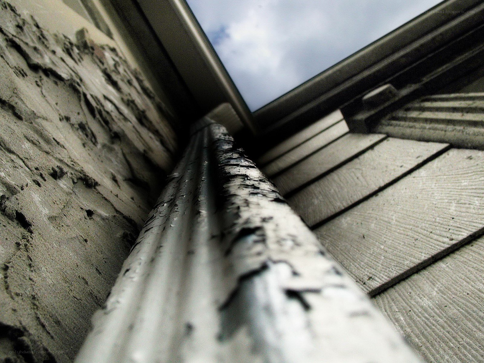 weathered gutter and siding