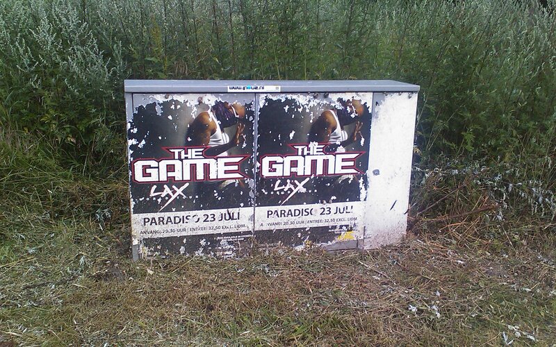 weathered poster on utility box