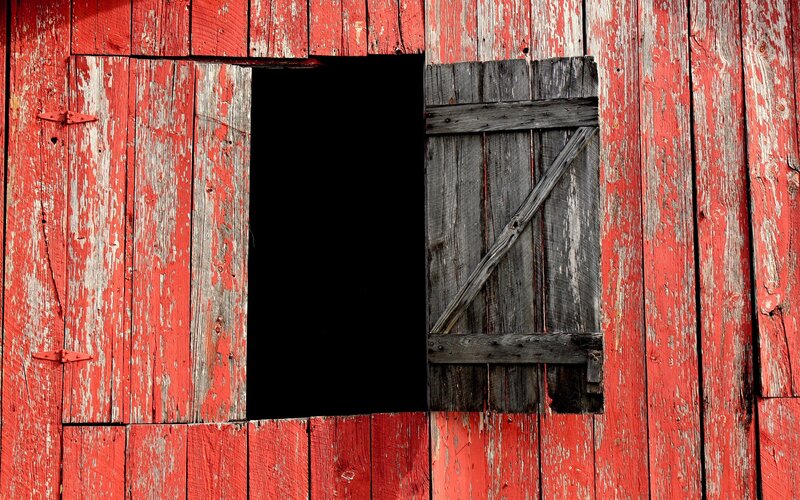 weathered red barn wall