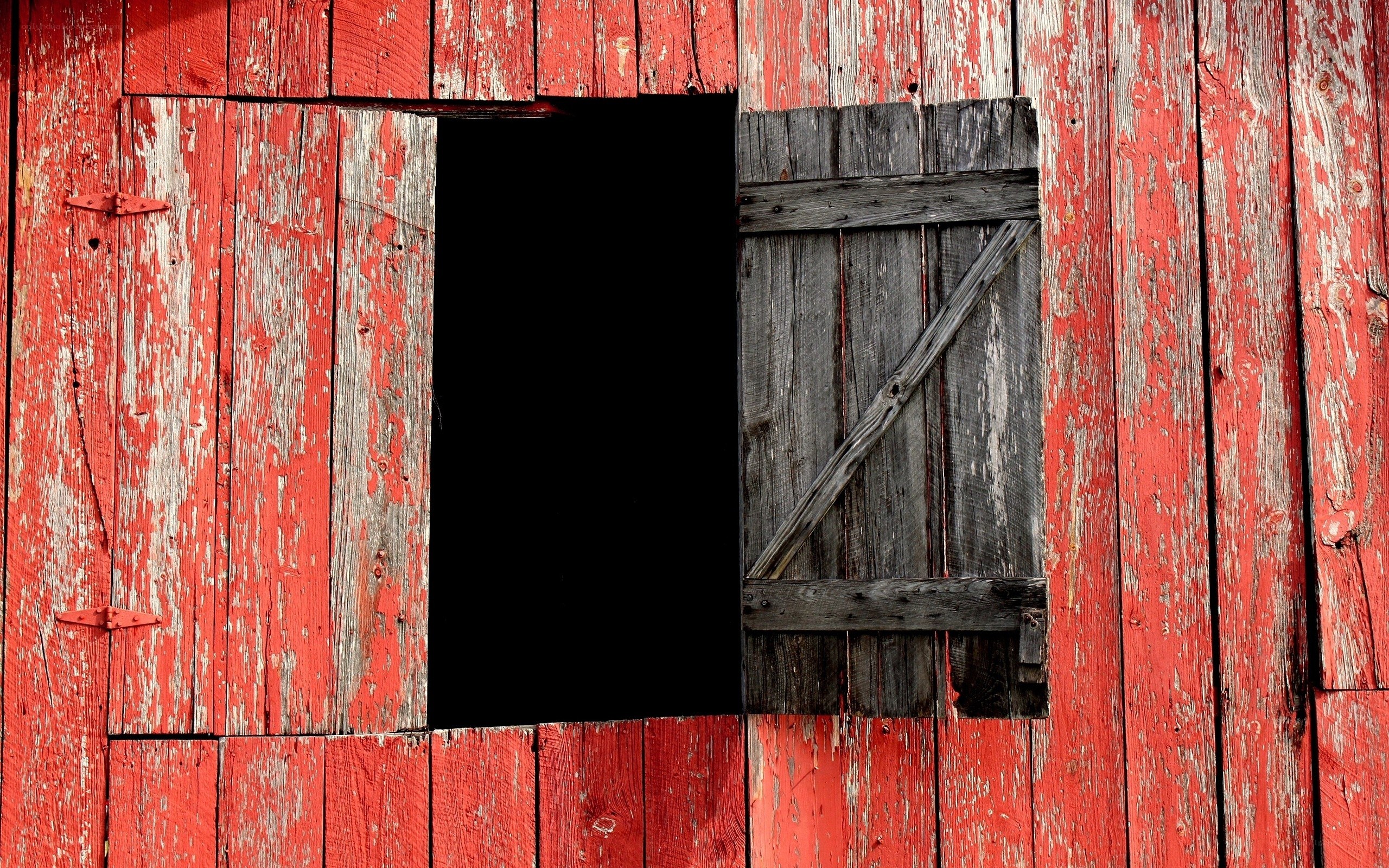 weathered red barn window