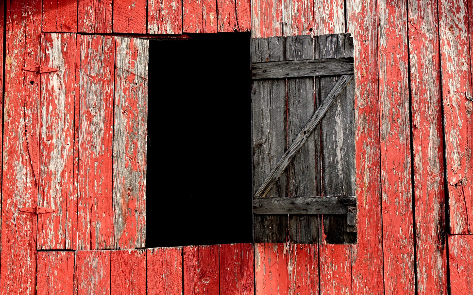 weathered red barn window