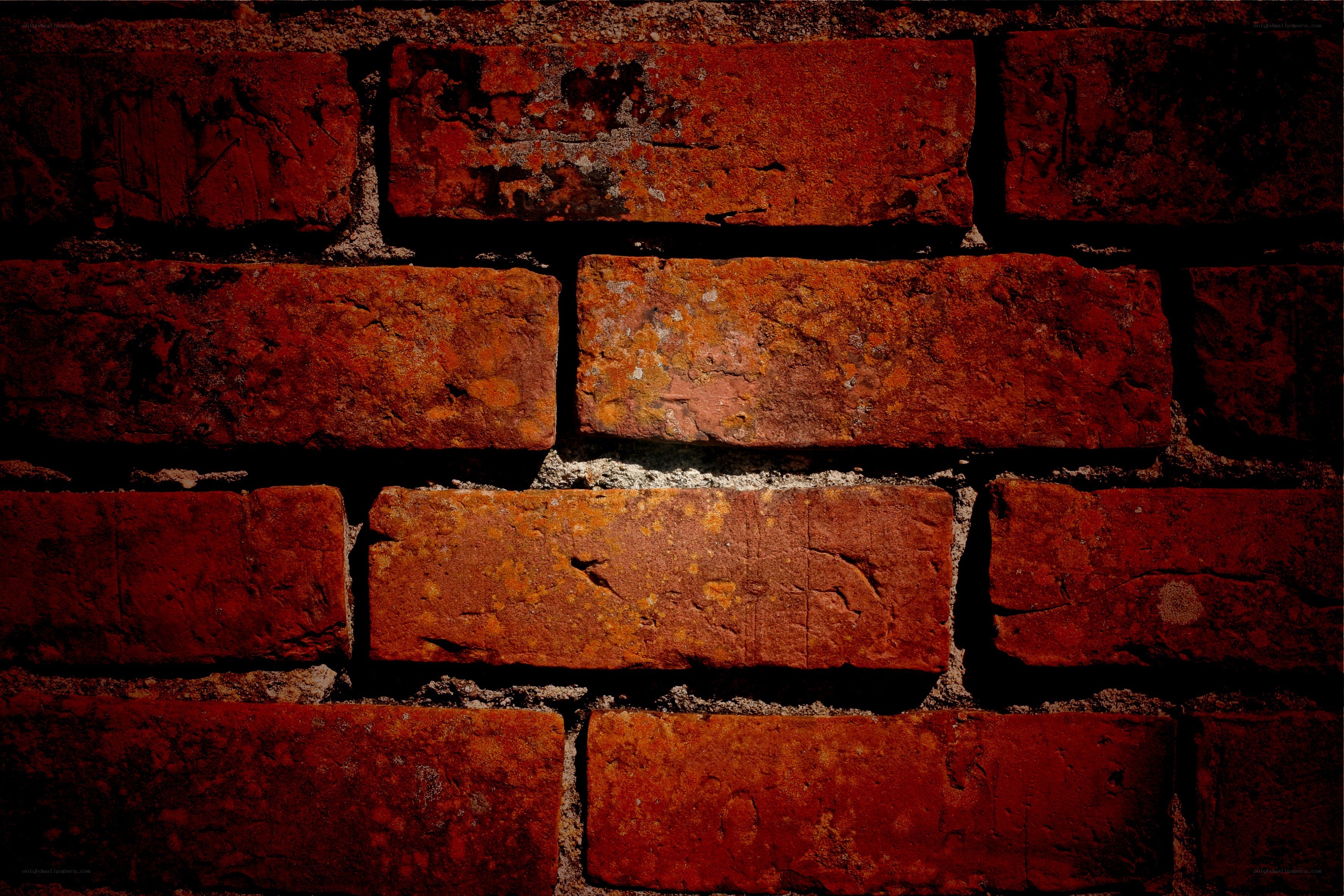 weathered red brick wall
