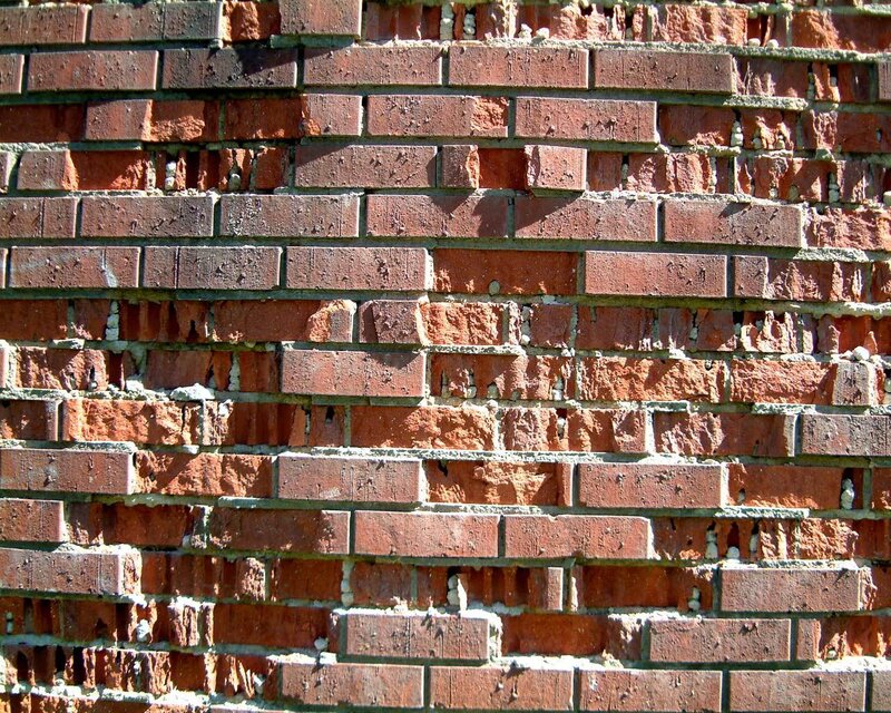 weathered red brick wall