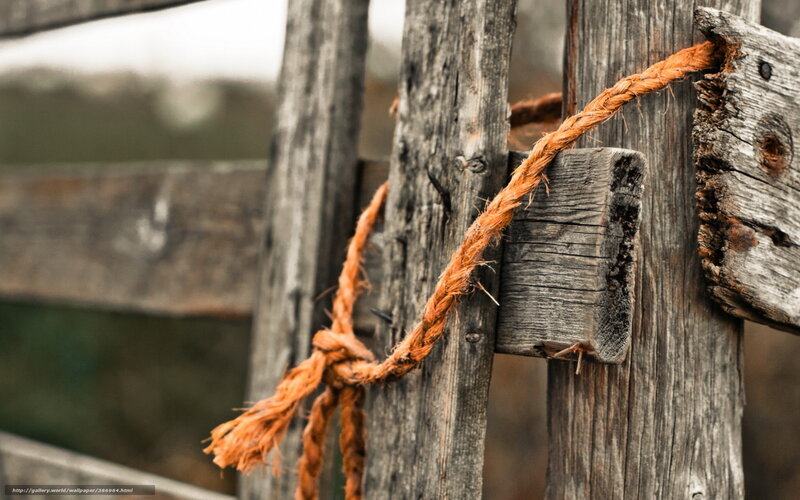 Weathered Rope on Wooden Fence