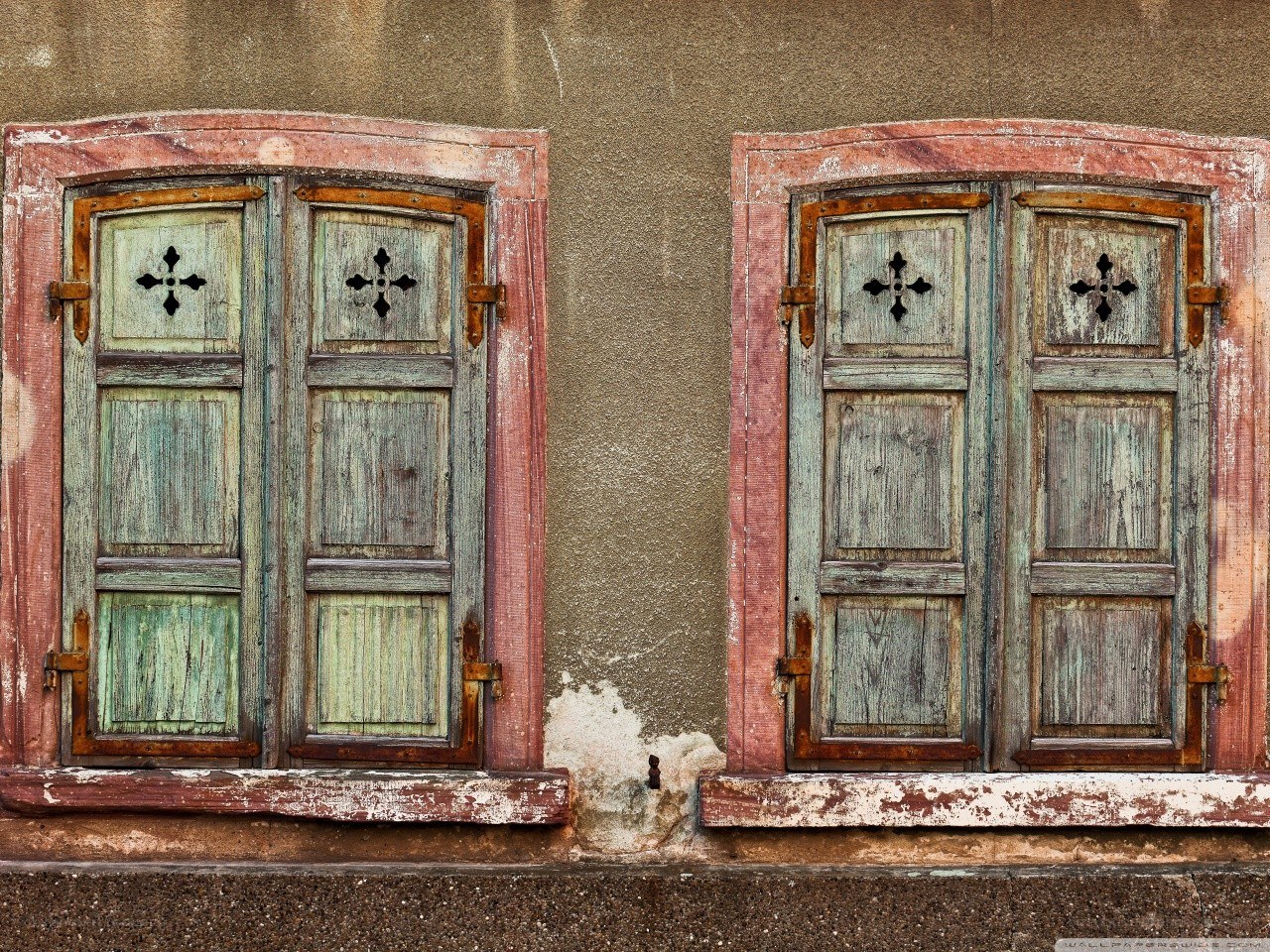 Weathered shutters on old building