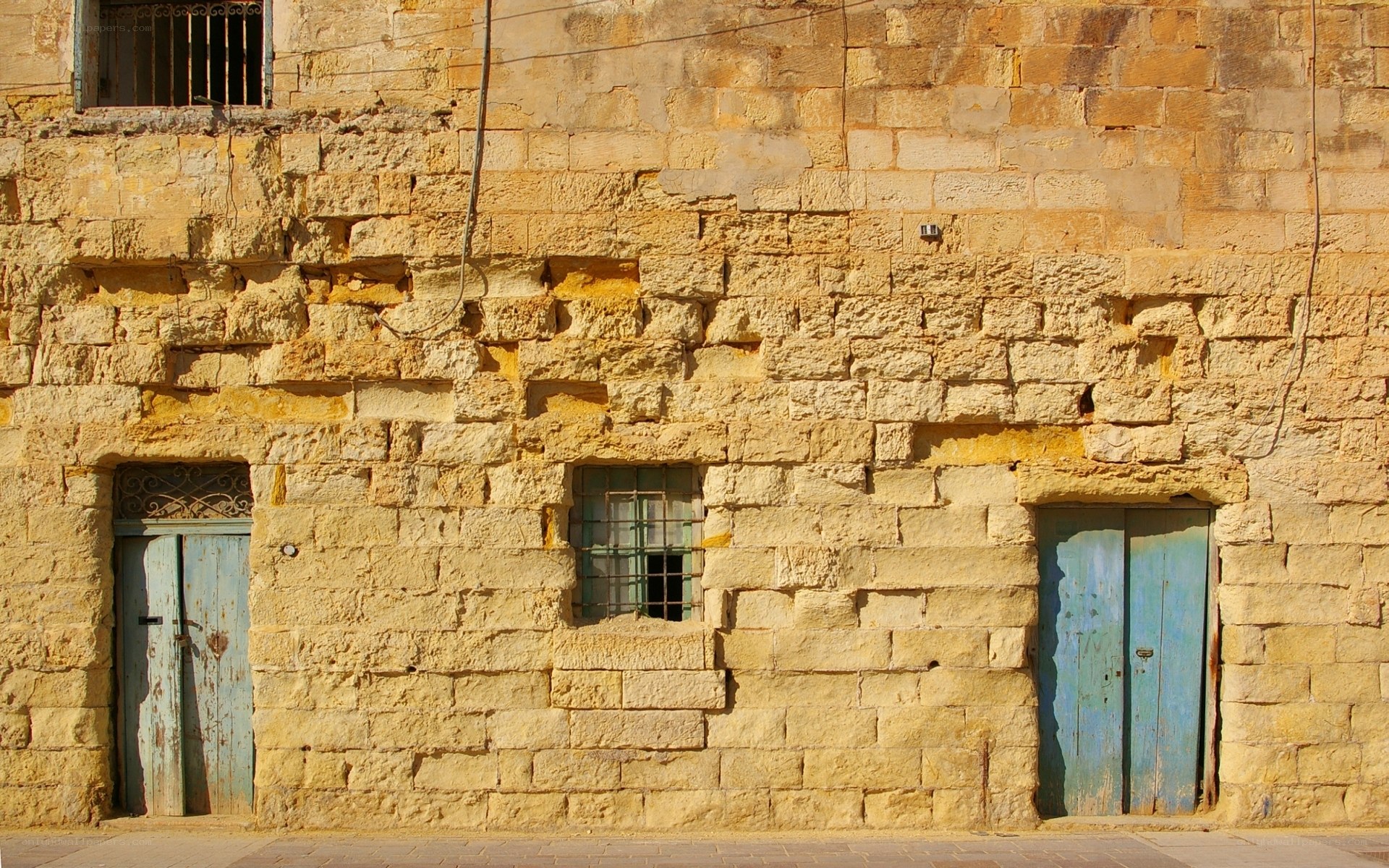 weathered stone building facade