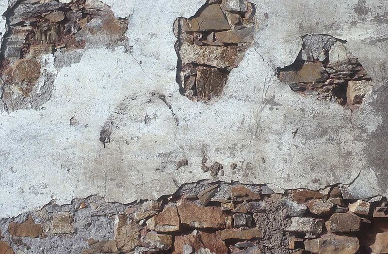 weathered stone wall surface