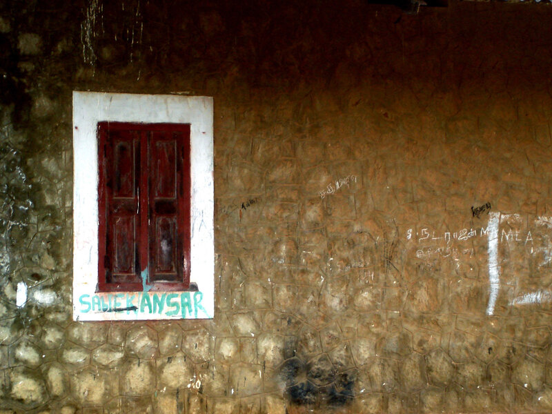 Weathered wall with red window
