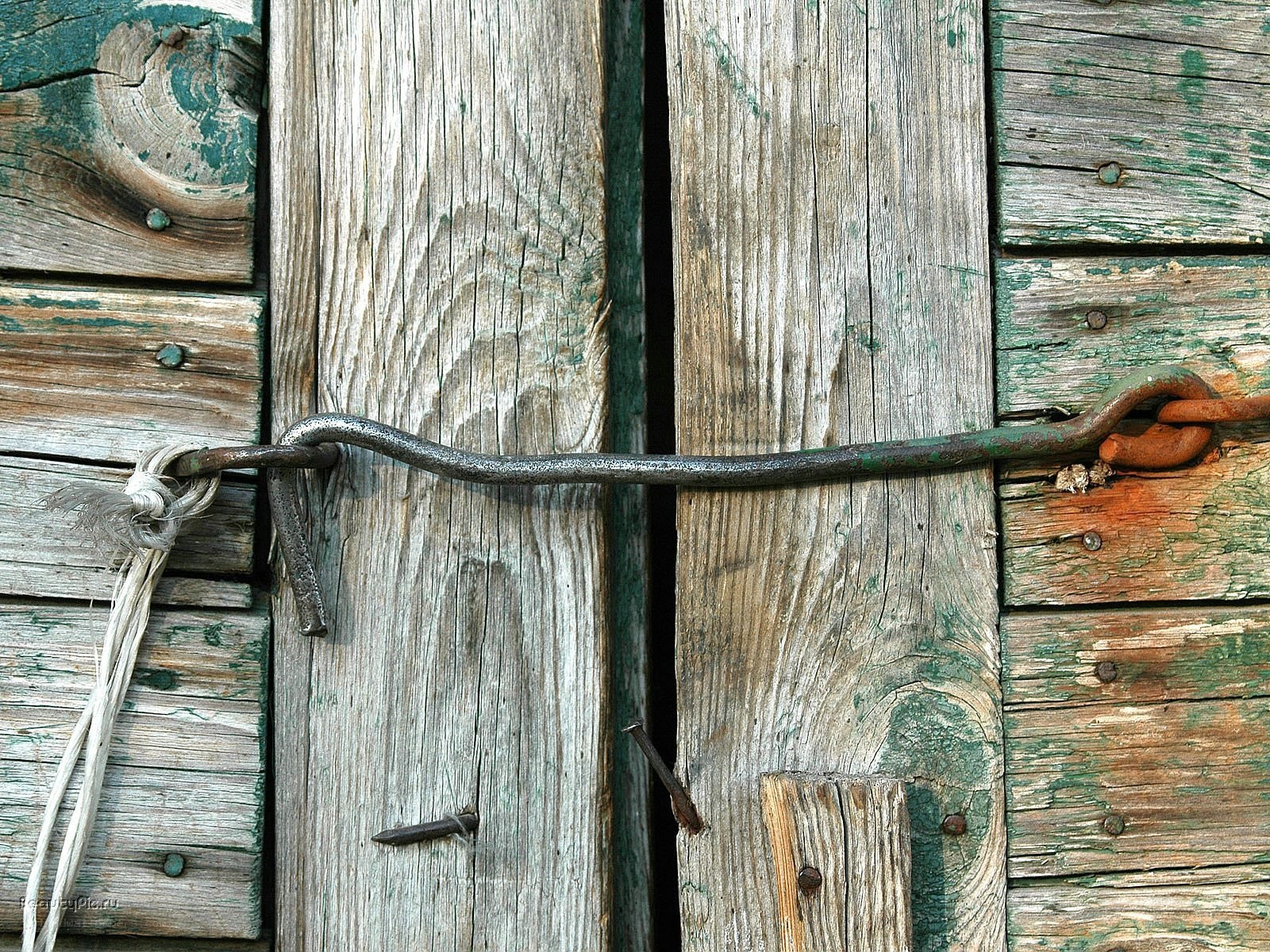 weathered wooden door with latch