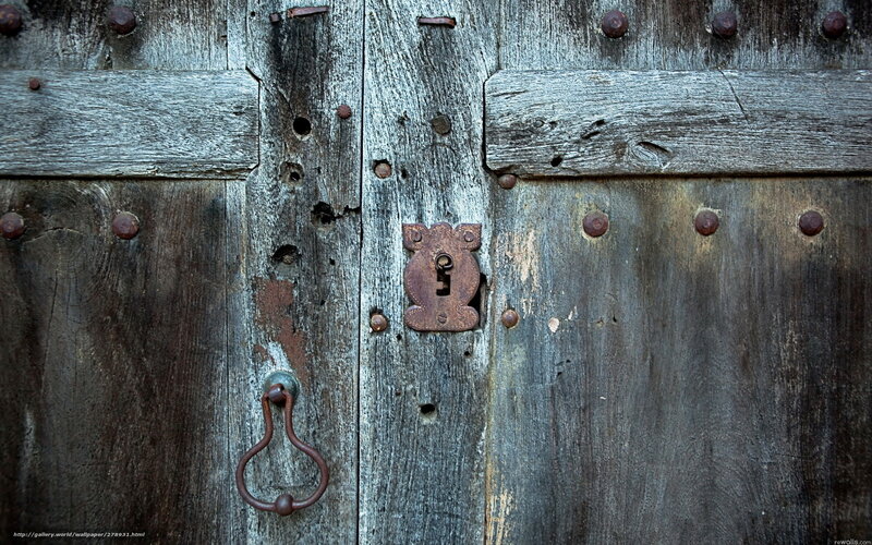 weathered wooden door with lock