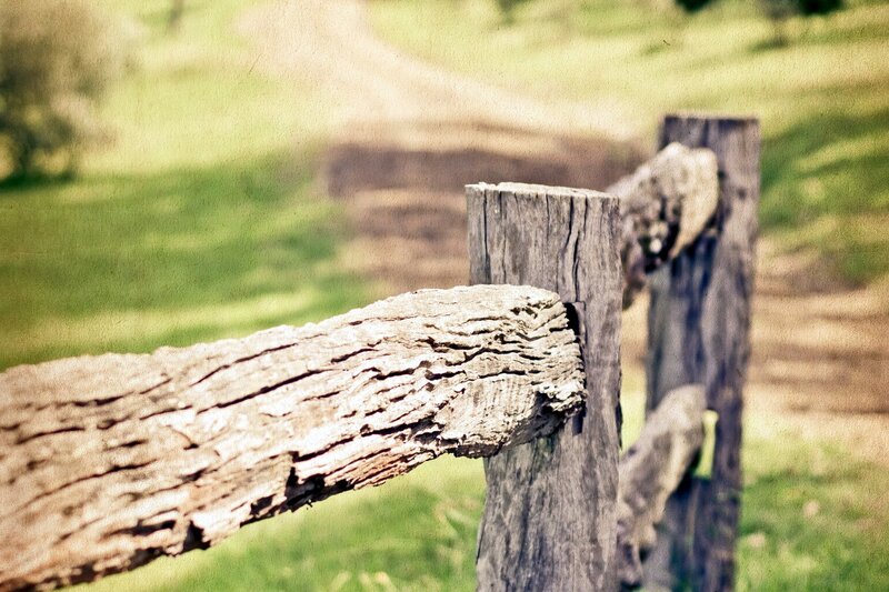 weathered wooden fence post