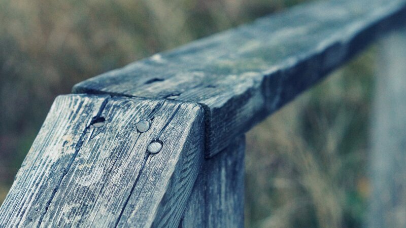 weathered wooden railing
