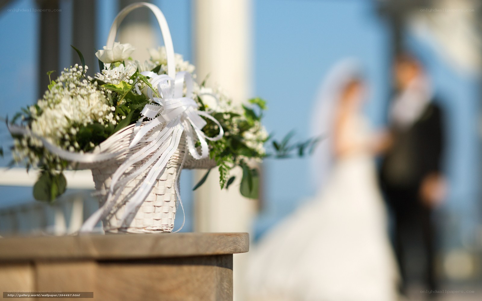 Wedding basket with couple in background