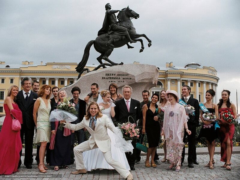 Wedding group at equestrian statue
