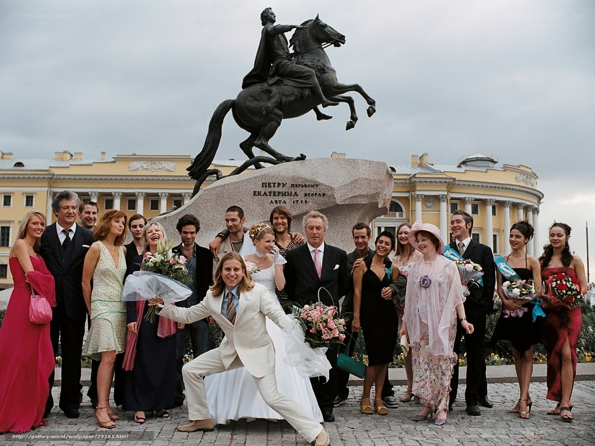 Wedding group at equestrian statue